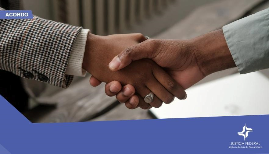 Mostra um aperto de mãos entre duas pessoas negras